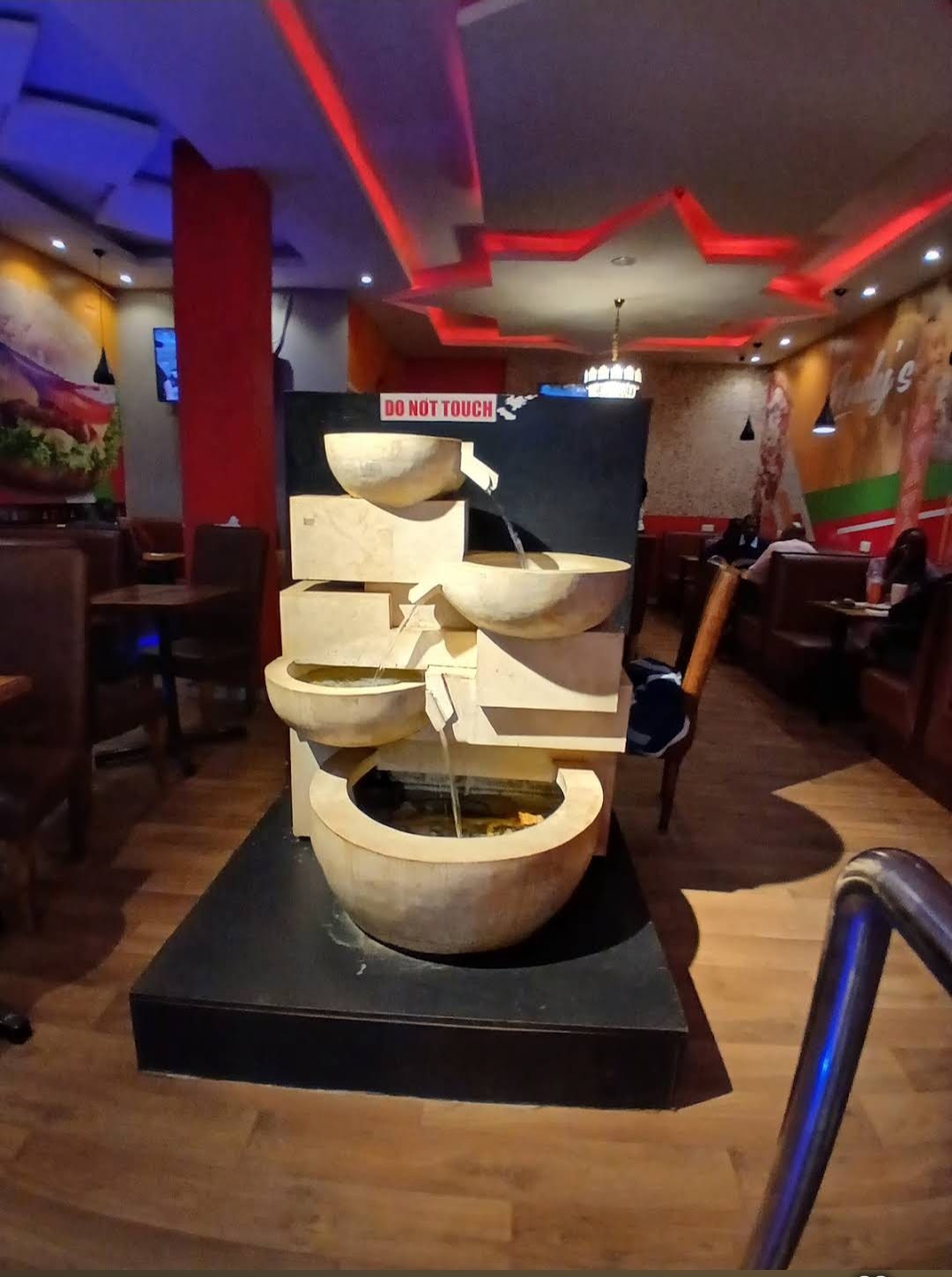 The cascading stone water feature inside Andy's Coffee House